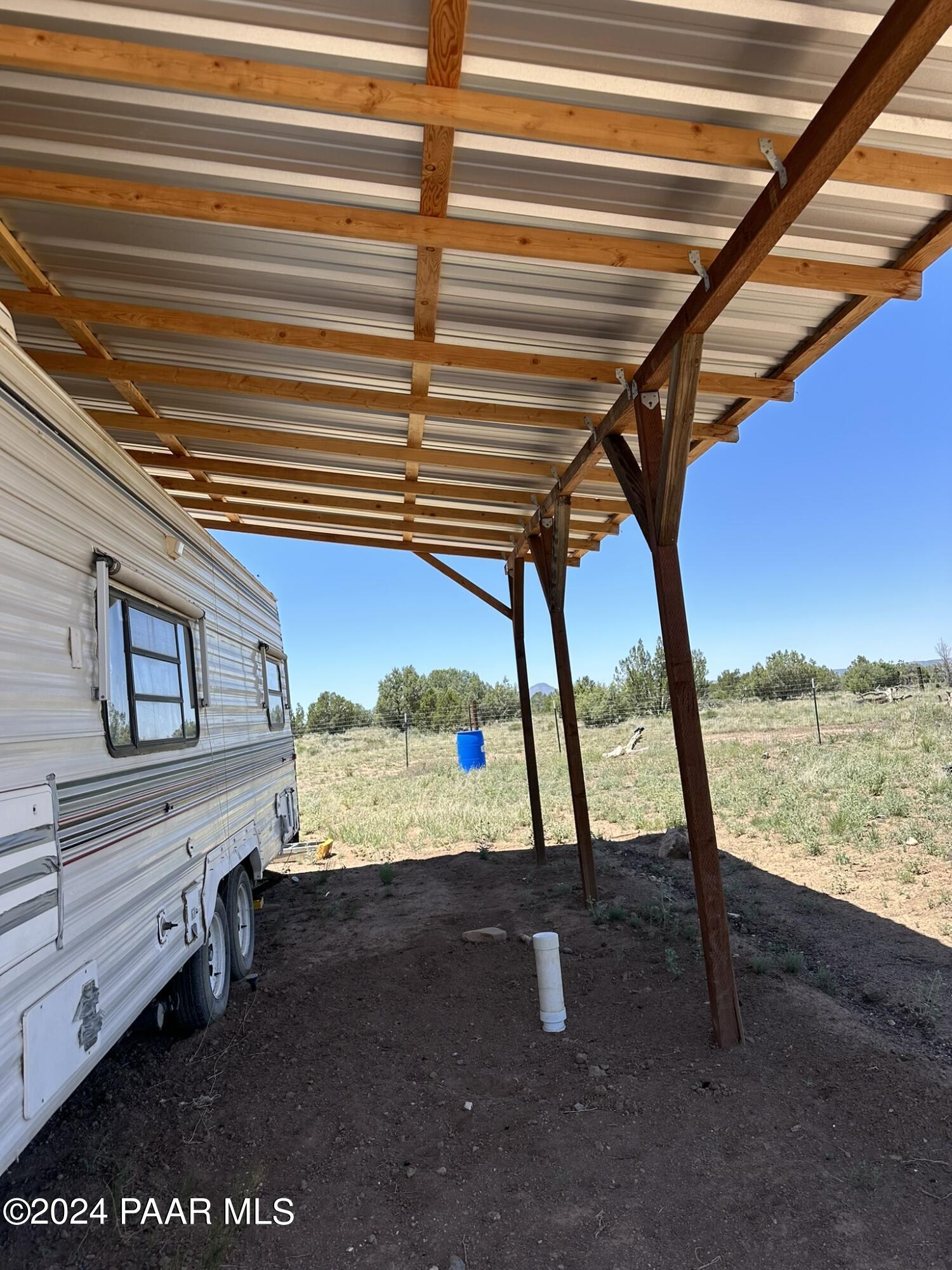 228 Flying Wrench Road Ash Fork, AZ 86320 - Photo 13 of 16 a view of a room with mountain view and wooden floor