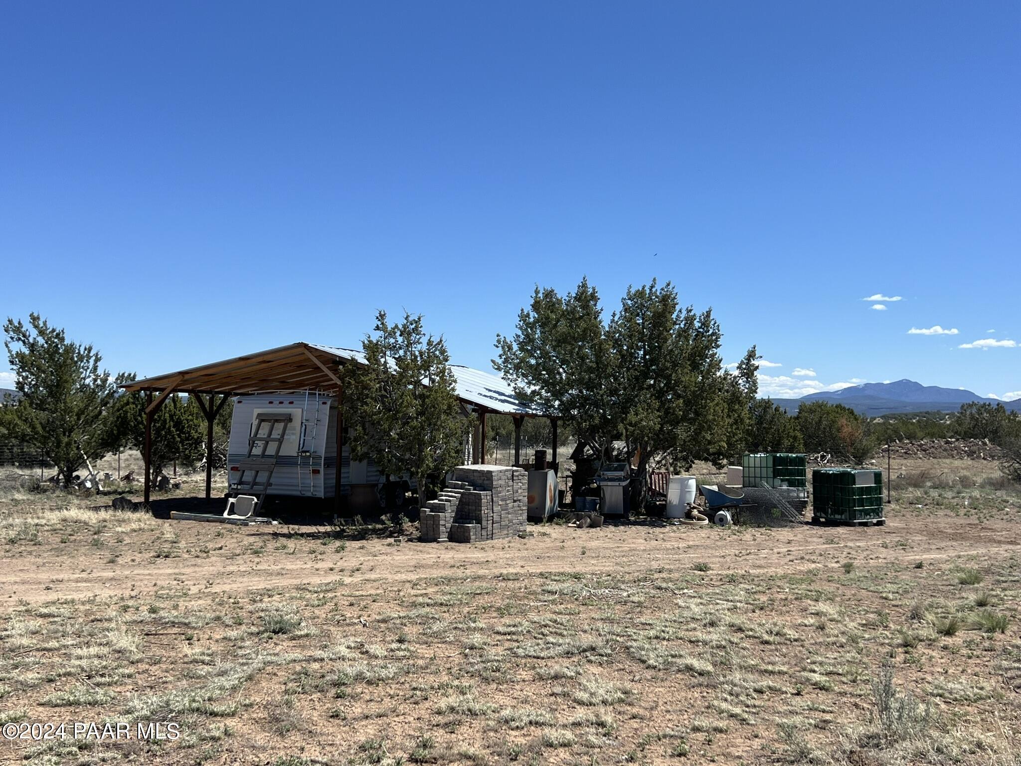 228 Flying Wrench Road Ash Fork, AZ 86320 - Photo 3 of 16 a view of a house with a yard