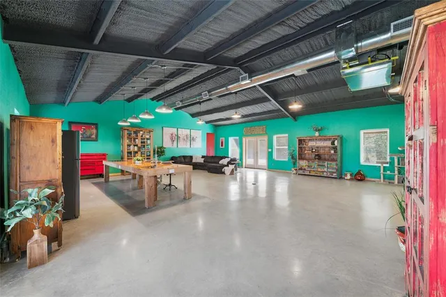 a room with lots of table and chairs