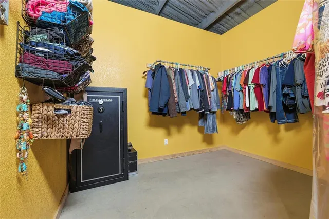 a bedroom with furniture and natural light