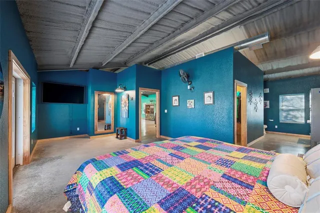 a bathroom with a sink a toilet and a window