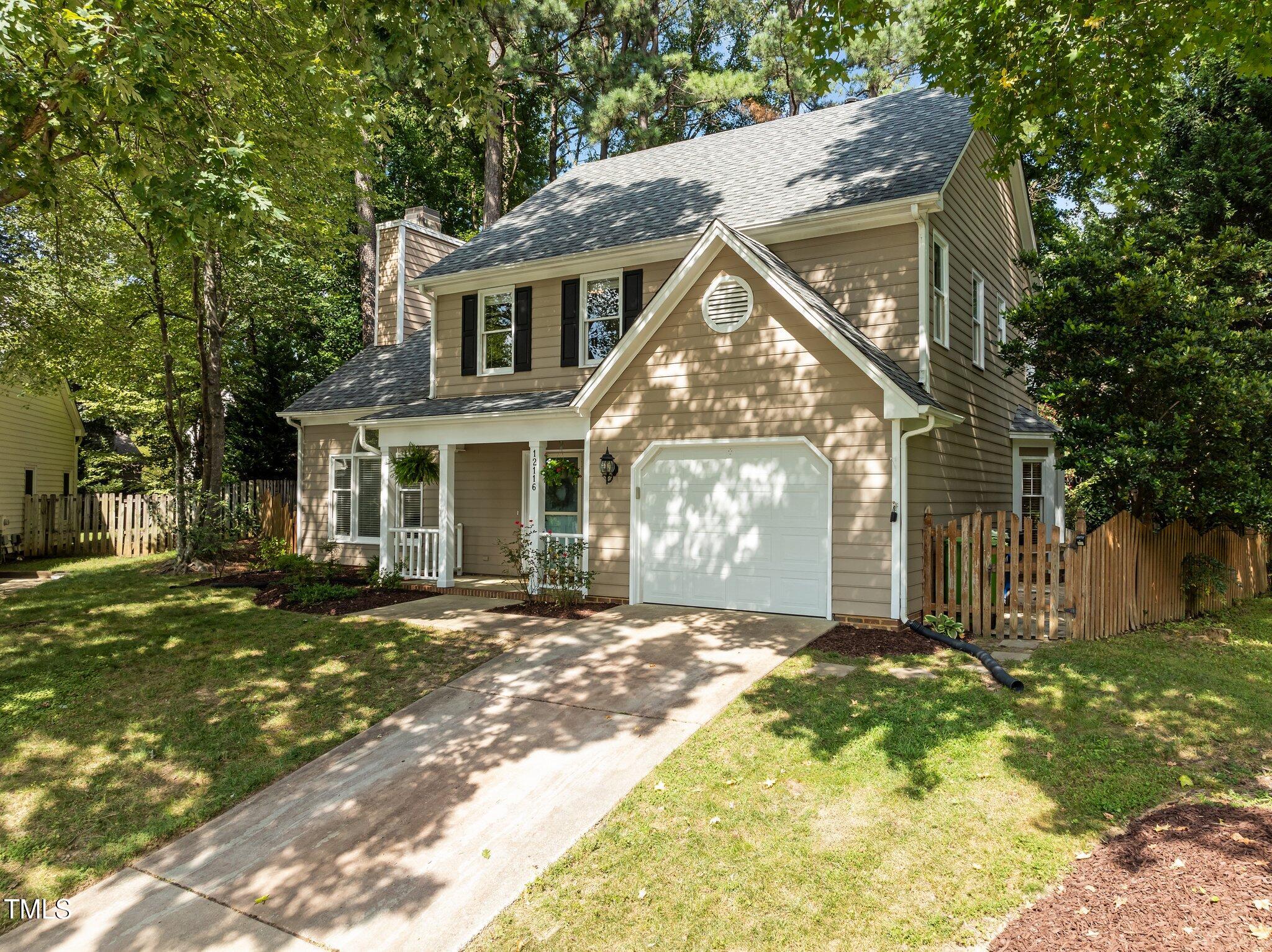 12116 Ranleigh Court Raleigh, NC 27613 - Photo 2 of 30 a view of a house with a yard