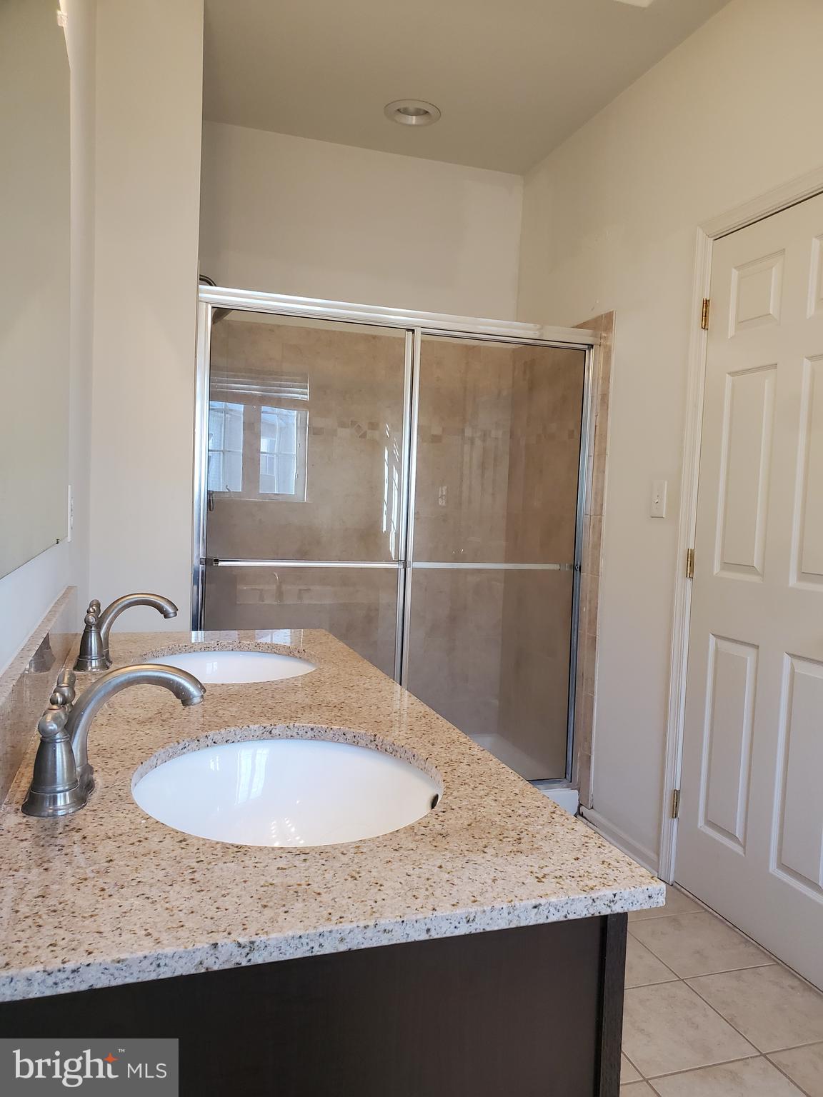 327 Lenape Way Claymont, DE 19703 - Photo 13 of 17 a bathroom with a granite countertop sink and a mirror