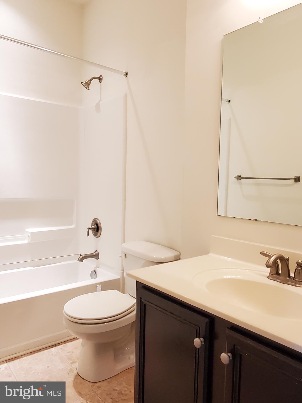 327 Lenape Way Claymont, DE 19703 - Photo 14 of 17 a bathroom with a sink a toilet and shower