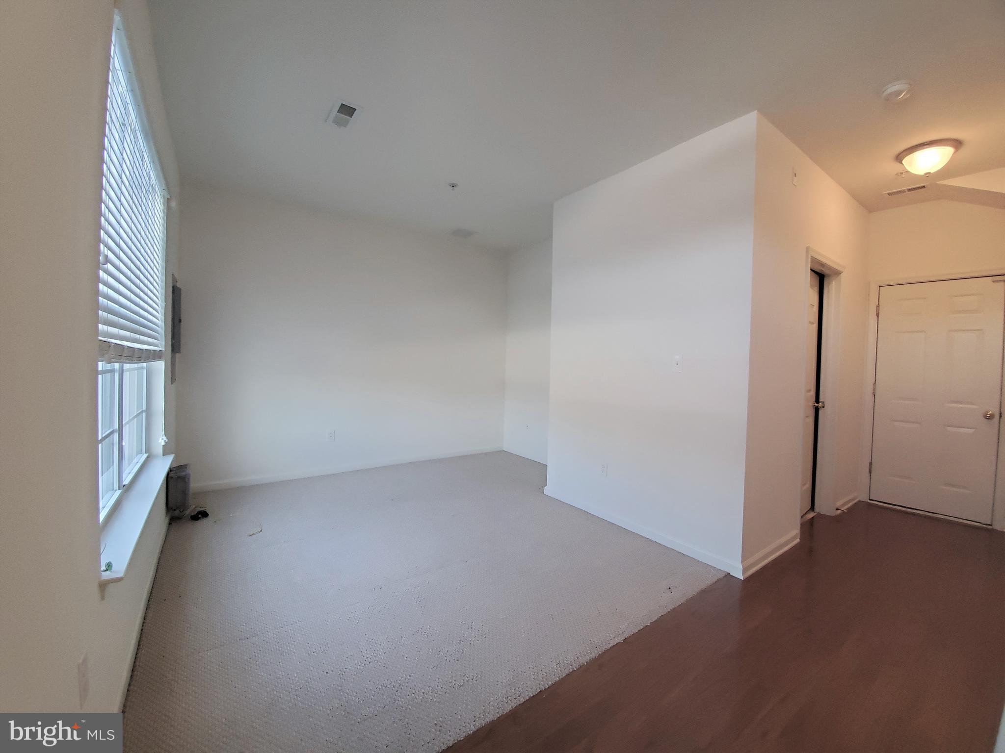 327 Lenape Way Claymont, DE 19703 - Photo 2 of 17 an empty room with windows