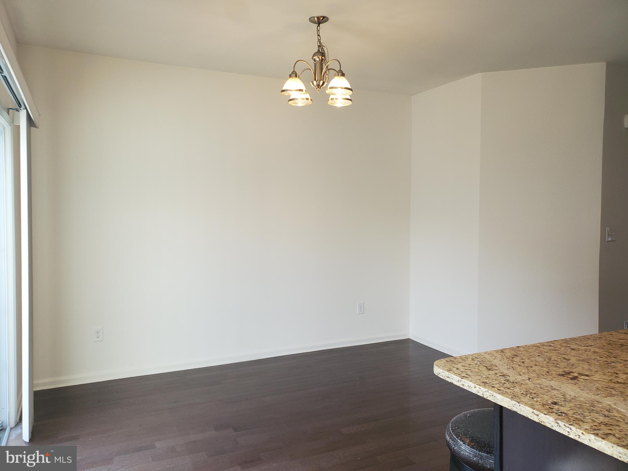 327 Lenape Way Claymont, DE 19703 - Photo 9 of 17 a view of a room with wooden floor and cabinetry