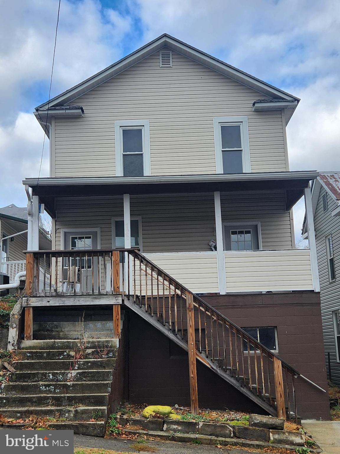 122 Spring Street, Unit B Keyser, WV 26726 - Photo 1 of 8 a front view of a house with balcony