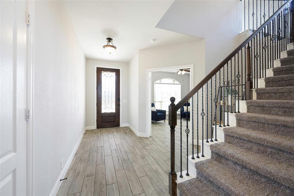 4059 Three Forks Road Kaufman, TX 75142 - Photo 3 of 25 a view of a hallway with wooden floor and entryway