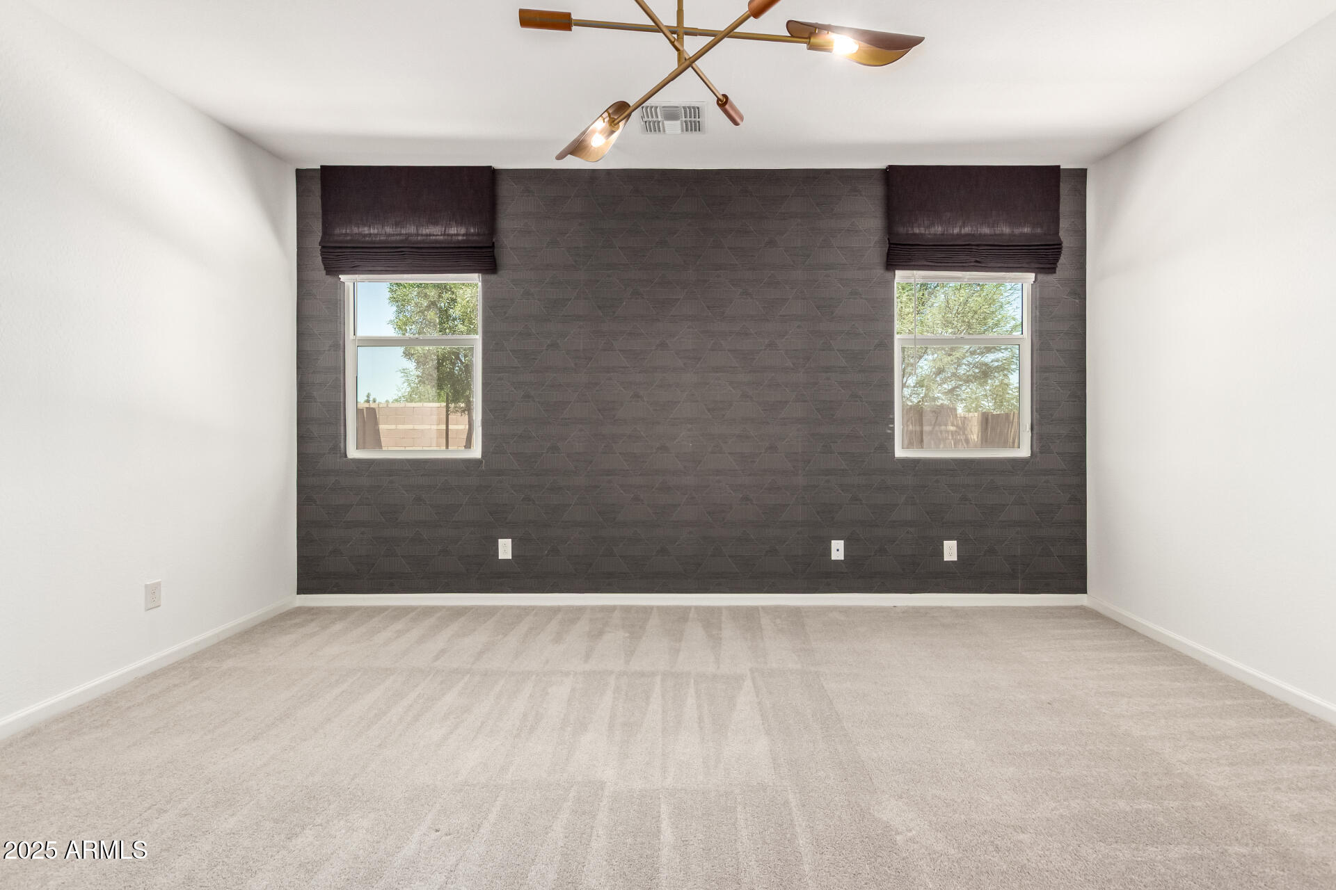 12524 West Trumbull Road Avondale, AZ 85323 - Photo 11 of 34 a view of an empty room with a window