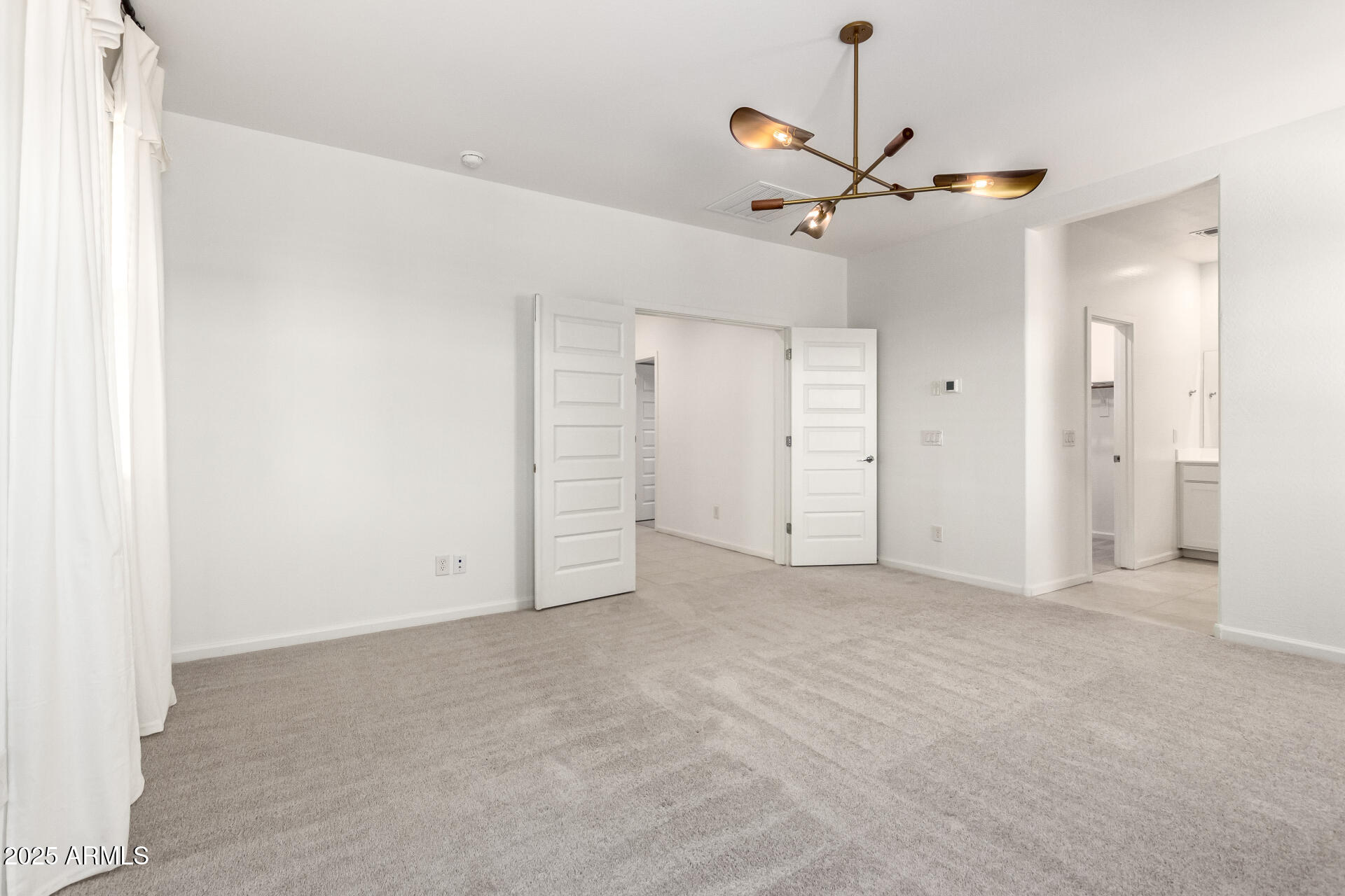 12524 West Trumbull Road Avondale, AZ 85323 - Photo 12 of 34 a view of an empty room