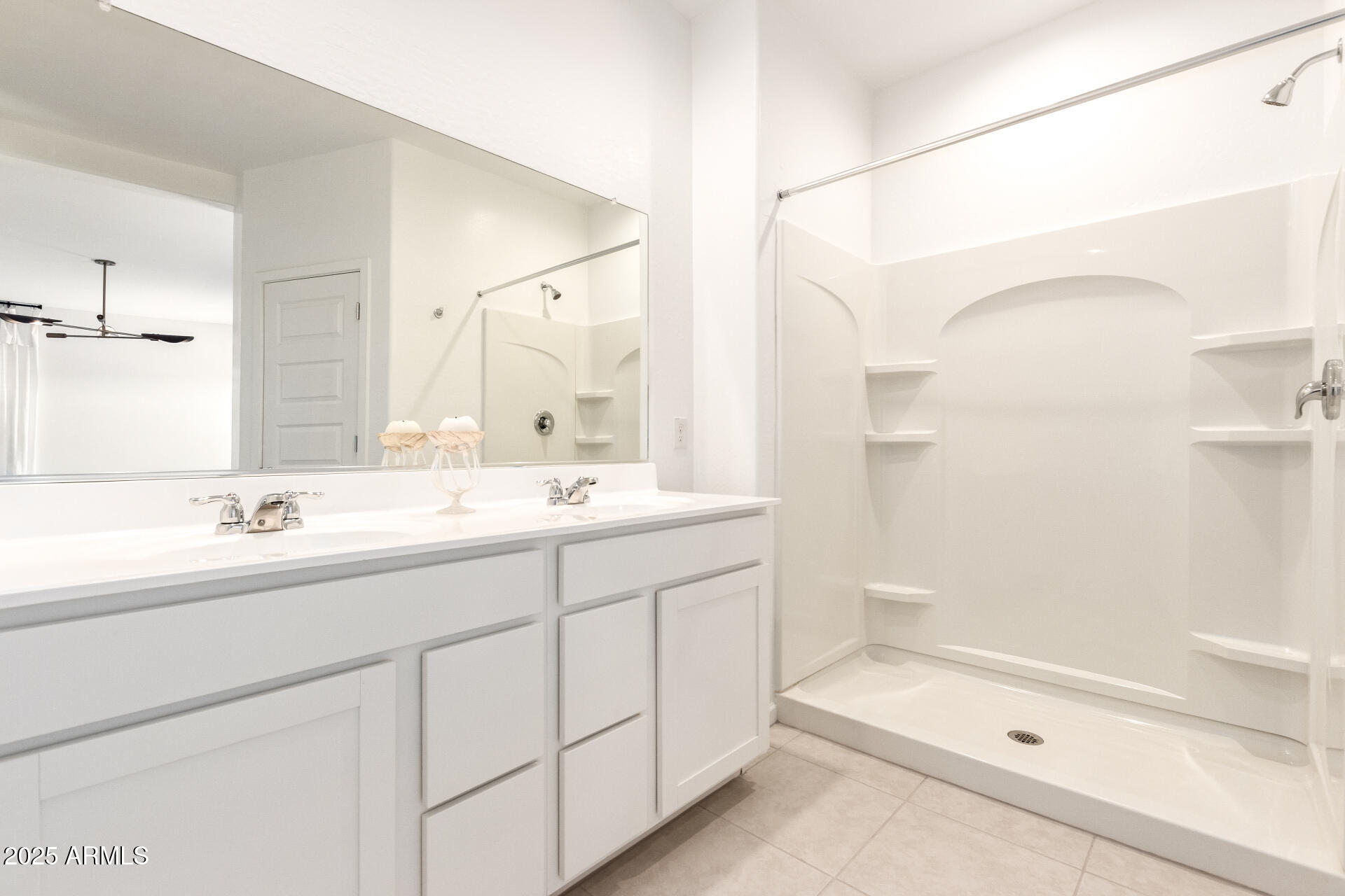 12524 West Trumbull Road Avondale, AZ 85323 - Photo 13 of 34 a bathroom with a sink a toilet and shower