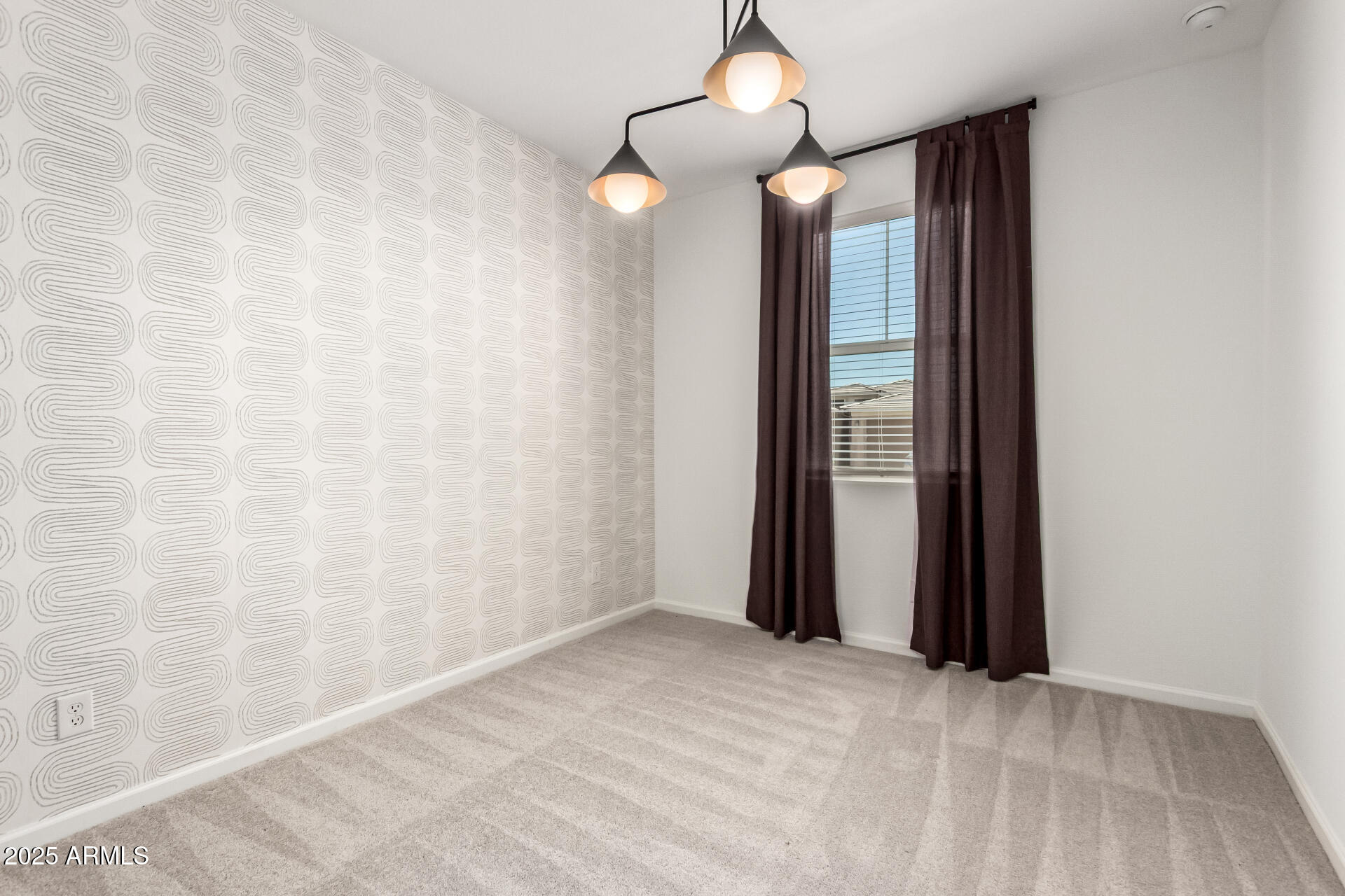 12524 West Trumbull Road Avondale, AZ 85323 - Photo 16 of 34 a view of an empty room and window