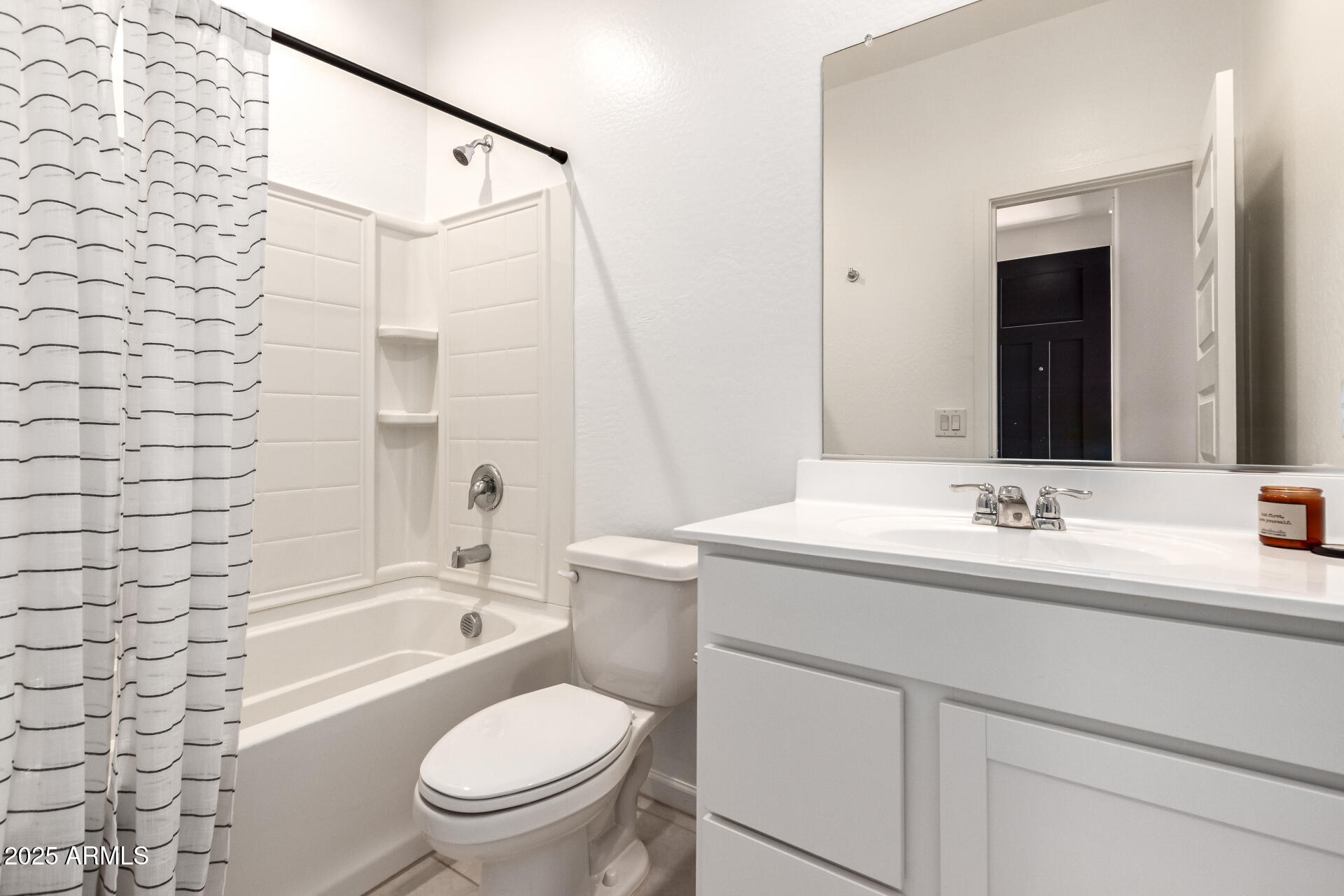 12524 West Trumbull Road Avondale, AZ 85323 - Photo 18 of 34 a bathroom with a sink toilet vanity and shower