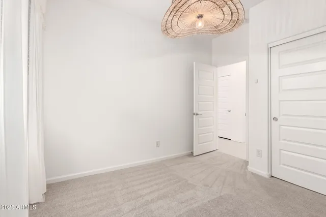 a view of a room with a sink and a mirror