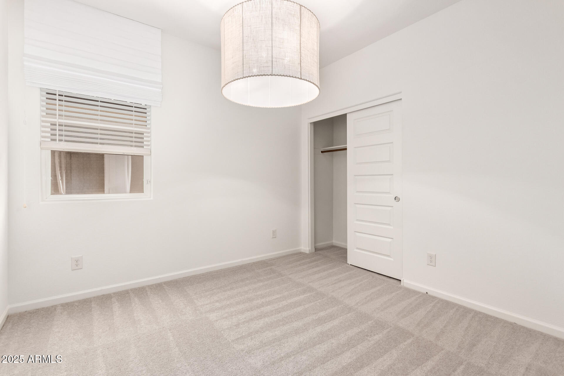 12524 West Trumbull Road Avondale, AZ 85323 - Photo 21 of 34 an empty room with a bathroom