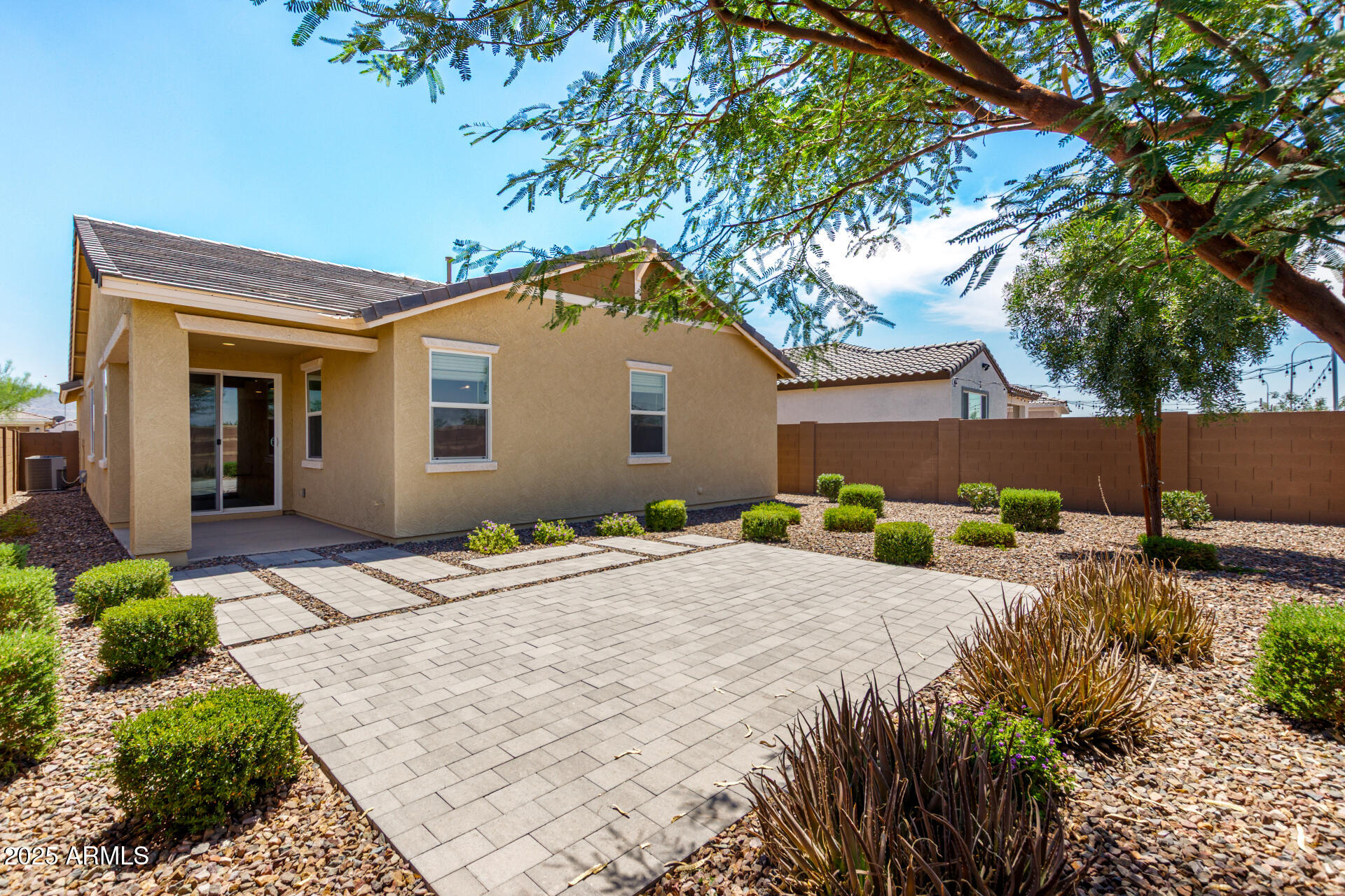 12524 West Trumbull Road Avondale, AZ 85323 - Photo 2 of 34 a front view of a house with garden