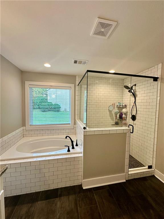 815 Poplar Street Monticello, GA 31064 - Photo 22 of 33 a bathroom with a tub and a shower