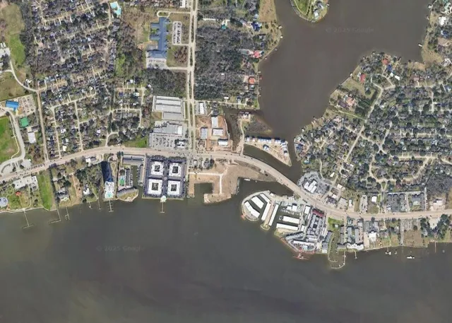 a view of hall way with table and chairs