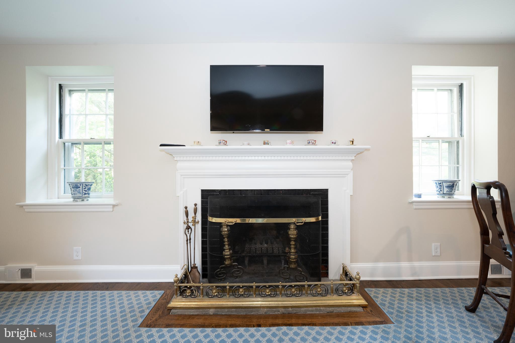 510 Lynmere Road Bryn Mawr, PA 19010 - Photo 18 of 44 a living room with a flat screen tv and a fireplace