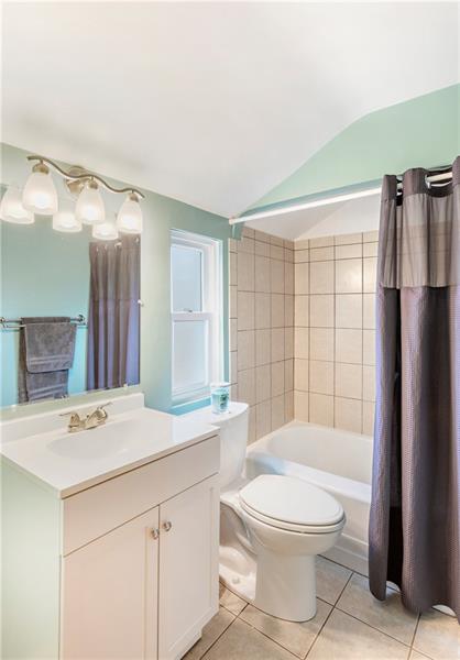 6333 Verona Road Verona, PA 15147 - Photo 14 of 25 Completely Updated Full Bathroom on Upper Level with Tile Floor, Tiled Tub/Shower Surround, Updated Vanity and Lighting.