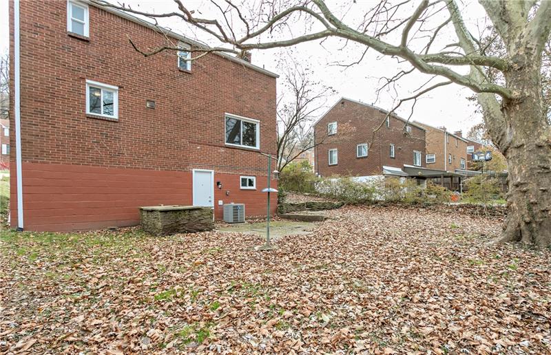 6333 Verona Road Verona, PA 15147 - Photo 20 of 25 The Basement Has a Door That Walks Out to a Level Back Yard with Small Patio Area.