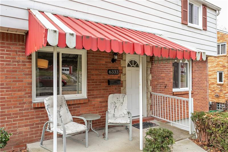 This Mostly Brick Home has Beautiful Keystone Detail Around the Doorway, and All New Multipane Windows That Were Just Installed in April of 2019!