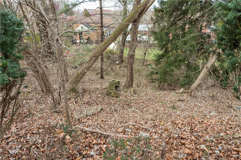 6333 Verona Road Verona, PA 15147 - Photo 23 of 25 Looking Down to the Lower Back Yard. There are Stone Steps Into the Wooded Area Below. Property Goes to the Fence.
