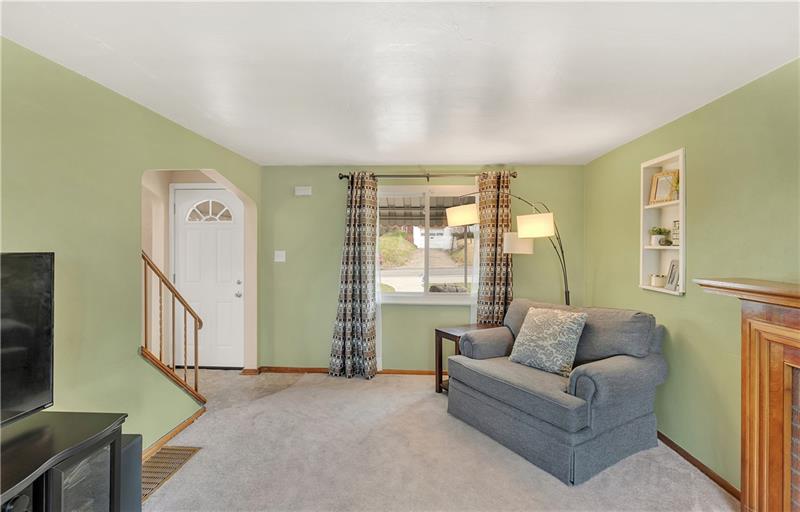 Newer Front Door and Tiled Entry.  Beautiful Arched Doorways. Neutral carpet and Paint.