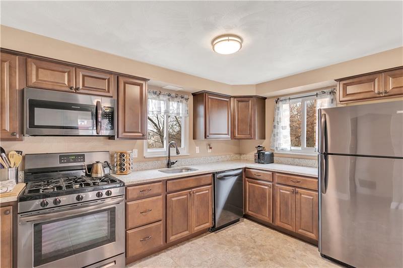 6333 Verona Road Verona, PA 15147 - Photo 8 of 25 Beautiful, Completely Updated Kitchen with BRAND New Granite Counter Tops Installed in 2019. Sleek, Black Stainless Steel Appliances from Frigidaire (Graphite Color) Only 2 Years Old!
