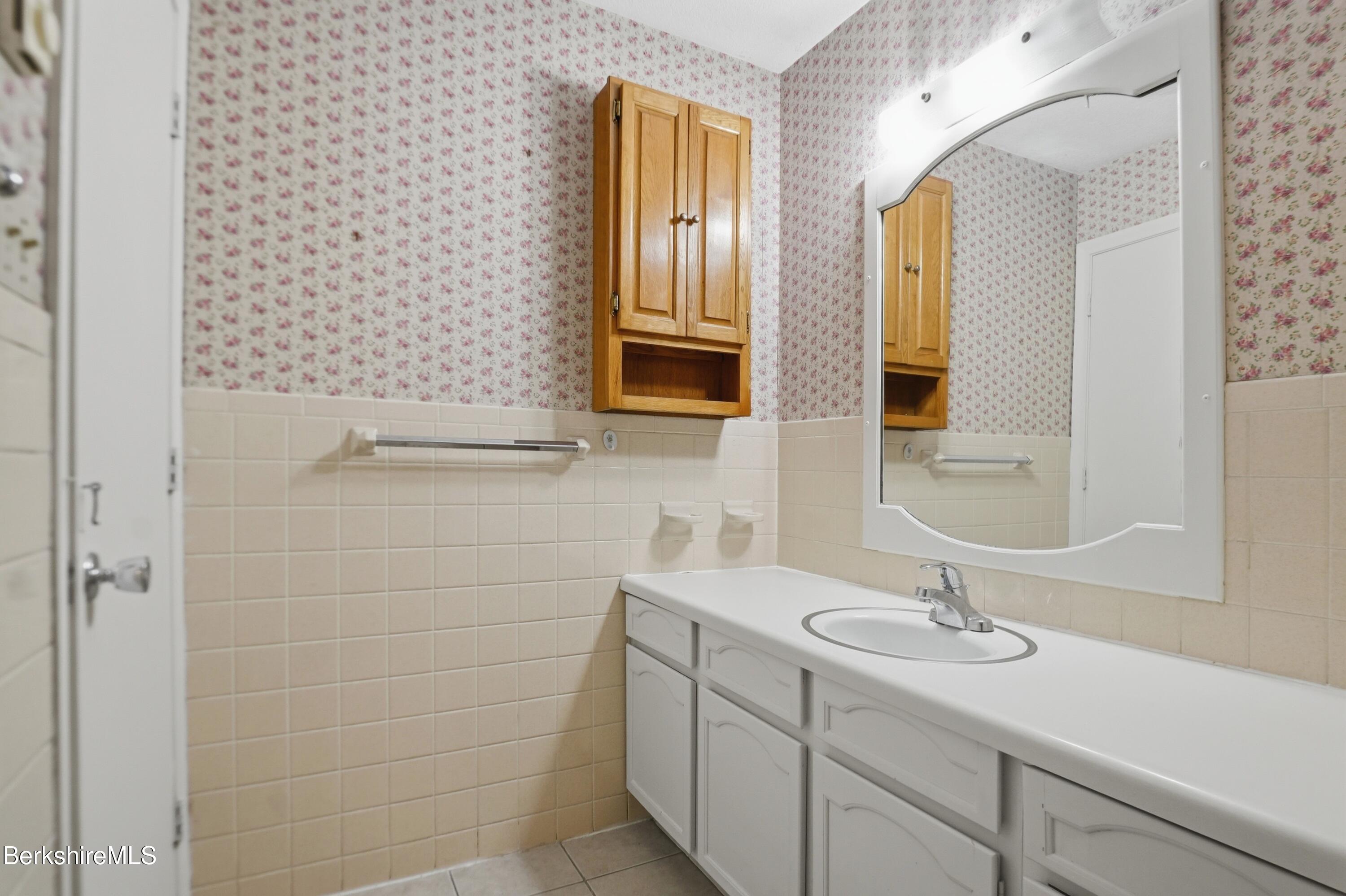 1 Colt Road, Unit 1 Pittsfield, MA 01201 - Photo 18 of 28 a bathroom with a sink and a mirror