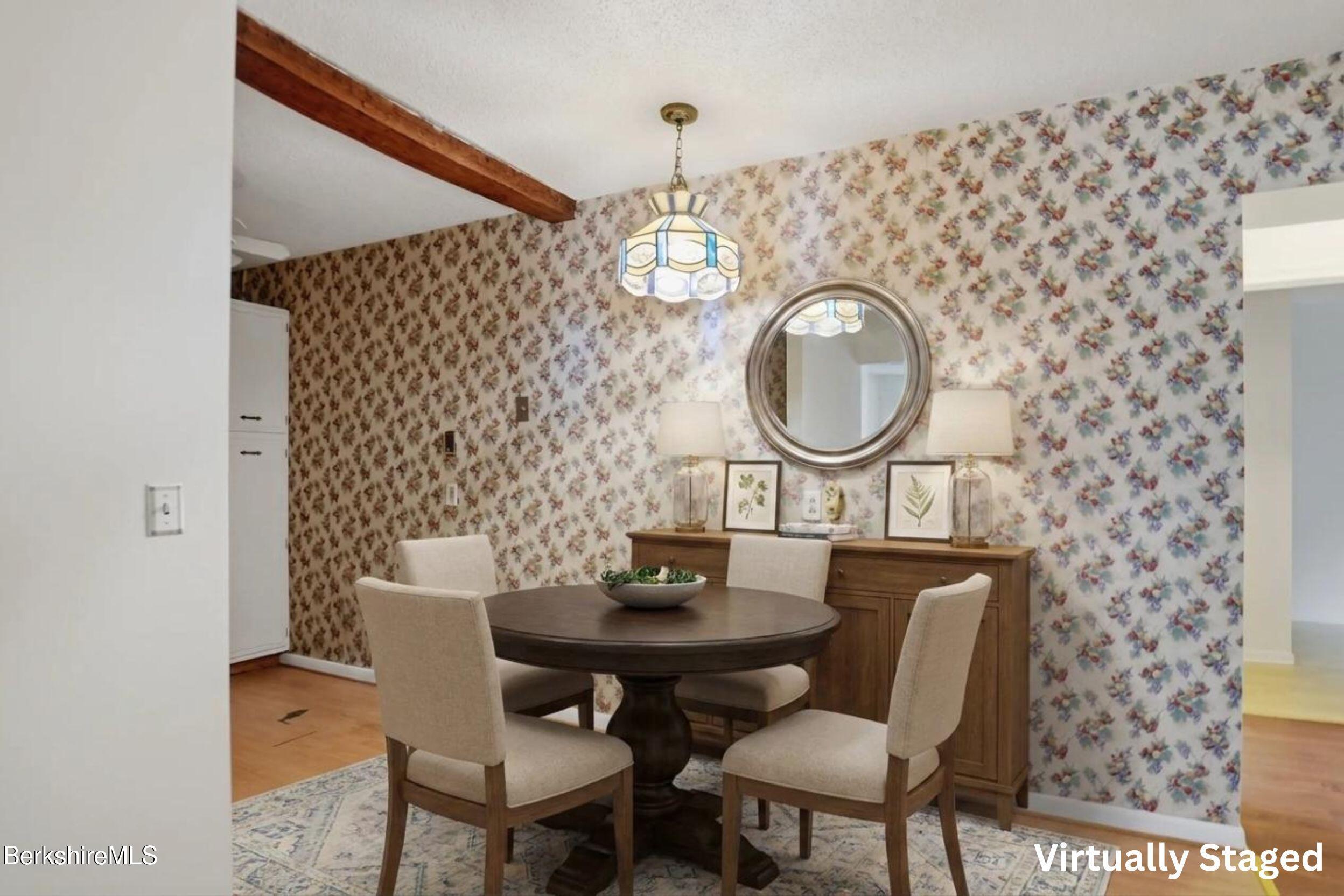 1 Colt Road, Unit 1 Pittsfield, MA 01201 - Photo 10 of 28 a view of a dining room with furniture and a mirror
