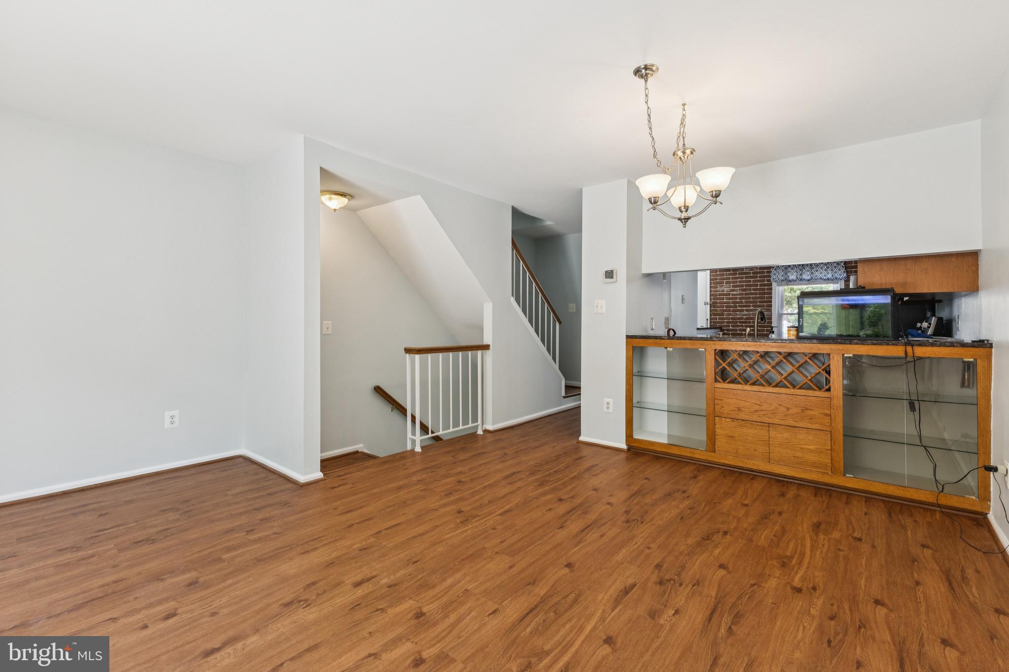 8485 Laurel Oak Drive Springfield, VA 22153 - Photo 11 of 40 a view of a kitchen with wooden floor and electronic appliances