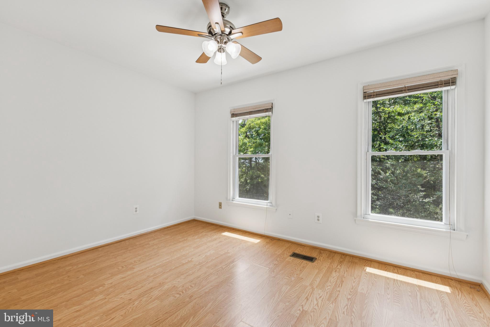 8485 Laurel Oak Drive Springfield, VA 22153 - Photo 14 of 40 an empty room with a window and a fan