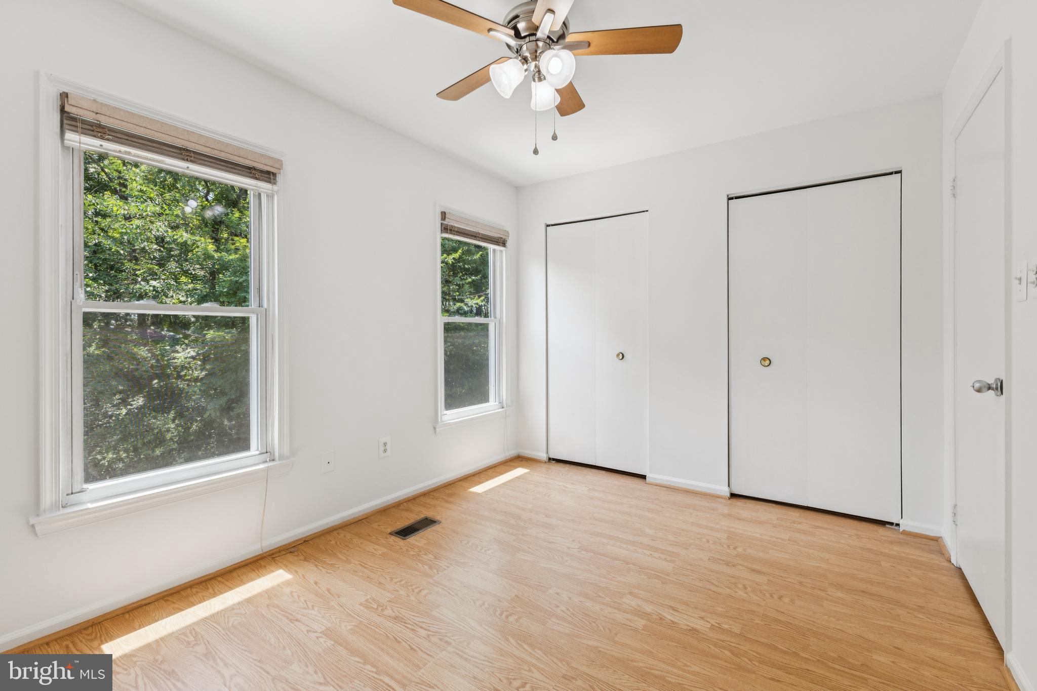 8485 Laurel Oak Drive Springfield, VA 22153 - Photo 15 of 40 wooden floor in an empty room with a window