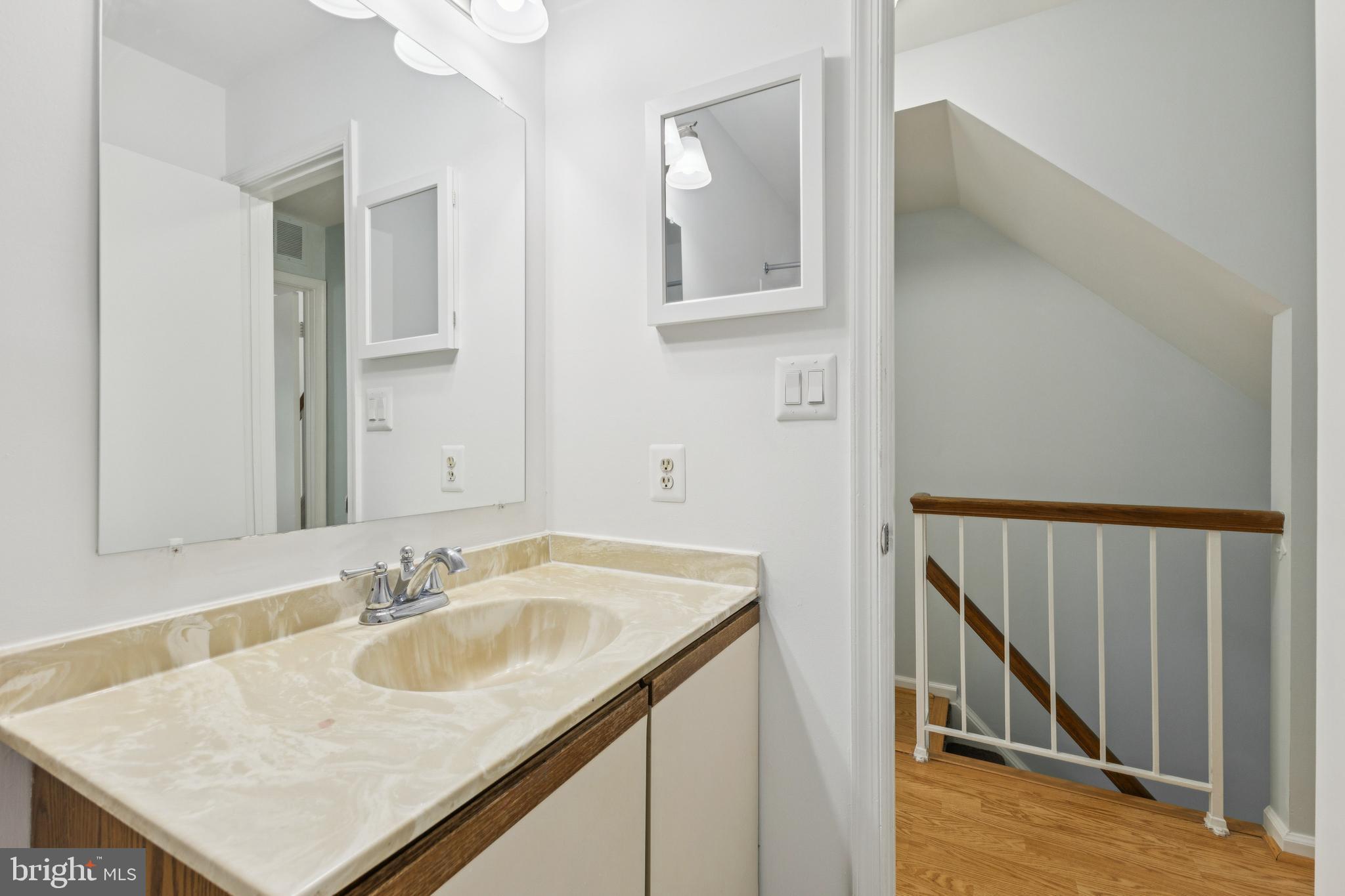 8485 Laurel Oak Drive Springfield, VA 22153 - Photo 19 of 40 a bathroom with a sink and a mirror