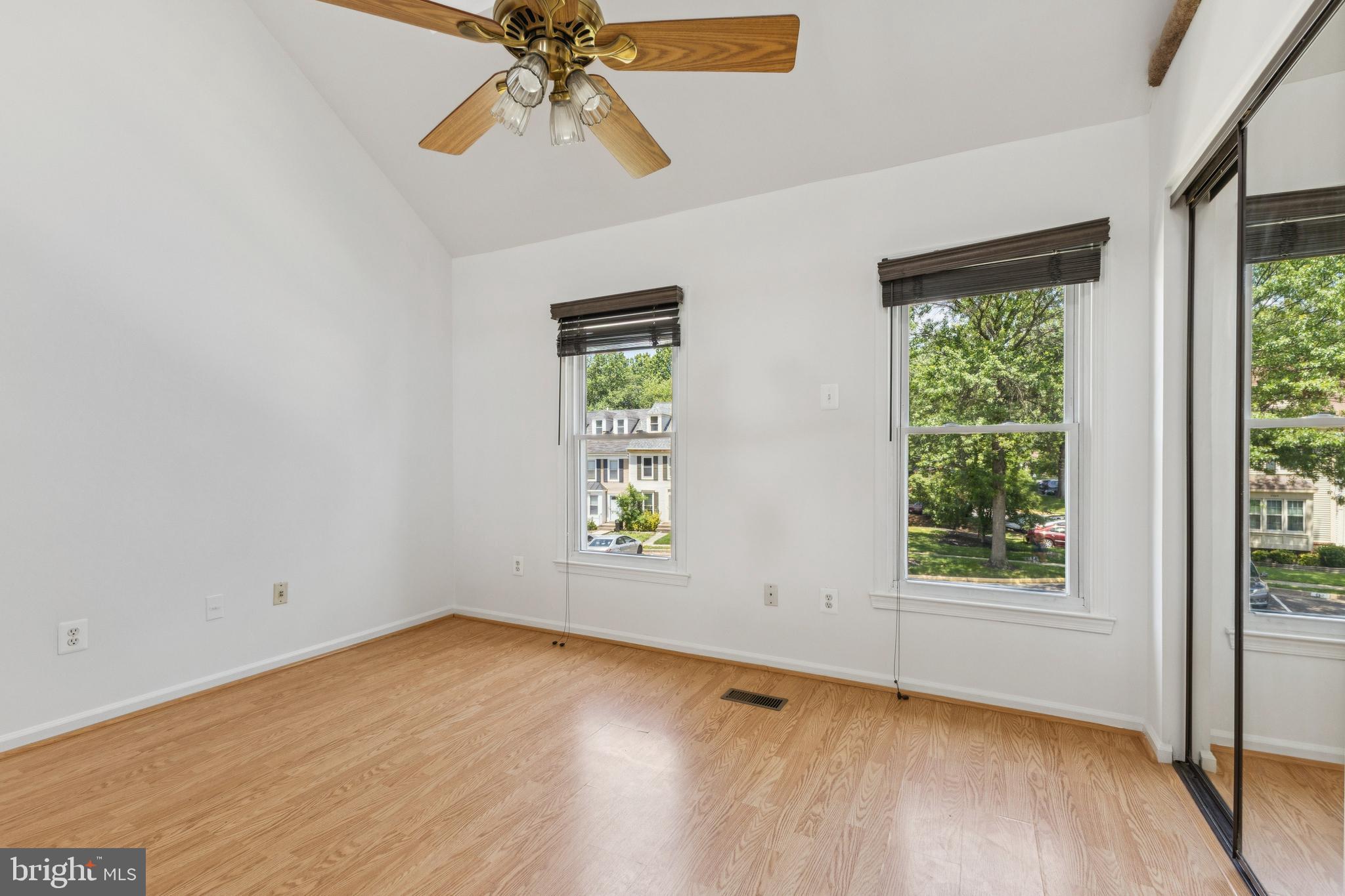 8485 Laurel Oak Drive Springfield, VA 22153 - Photo 21 of 40 an empty room with a window and a ceiling fan