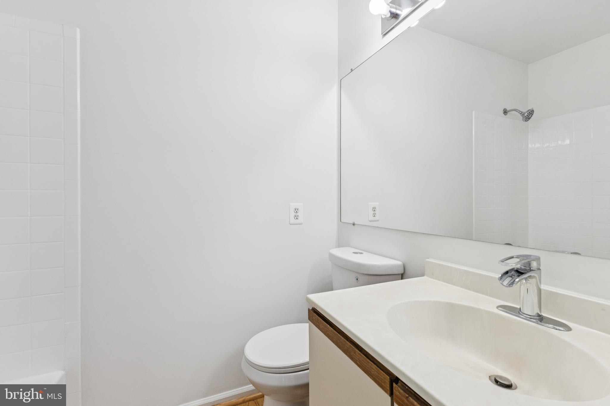 8485 Laurel Oak Drive Springfield, VA 22153 - Photo 24 of 40 a bathroom with a sink toilet and vanity