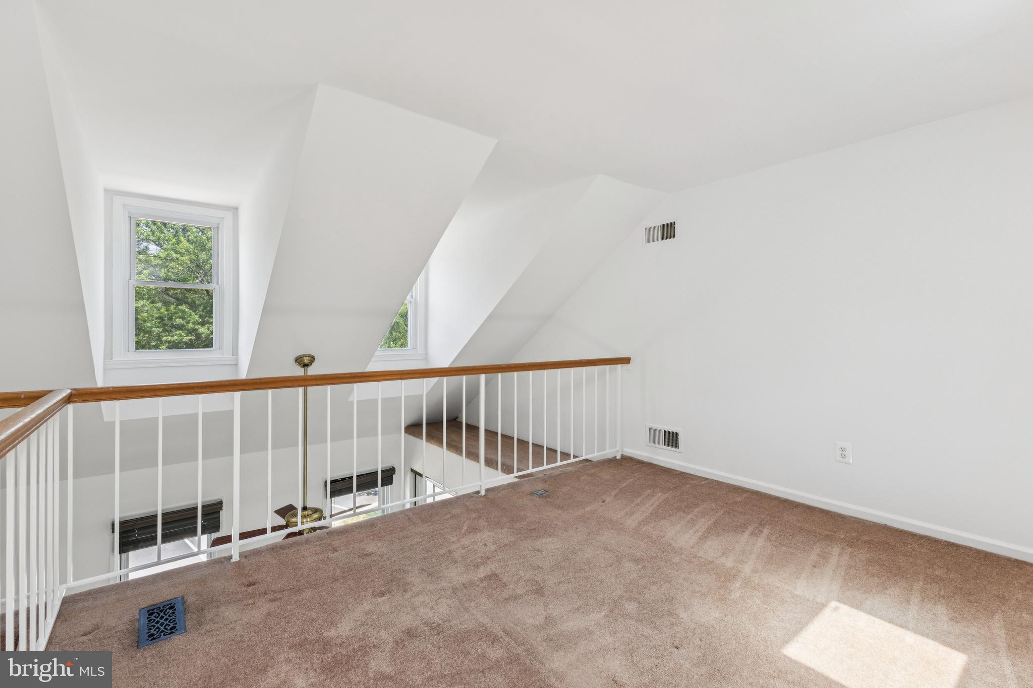 8485 Laurel Oak Drive Springfield, VA 22153 - Photo 26 of 40 a view of staircase with white walls and a window