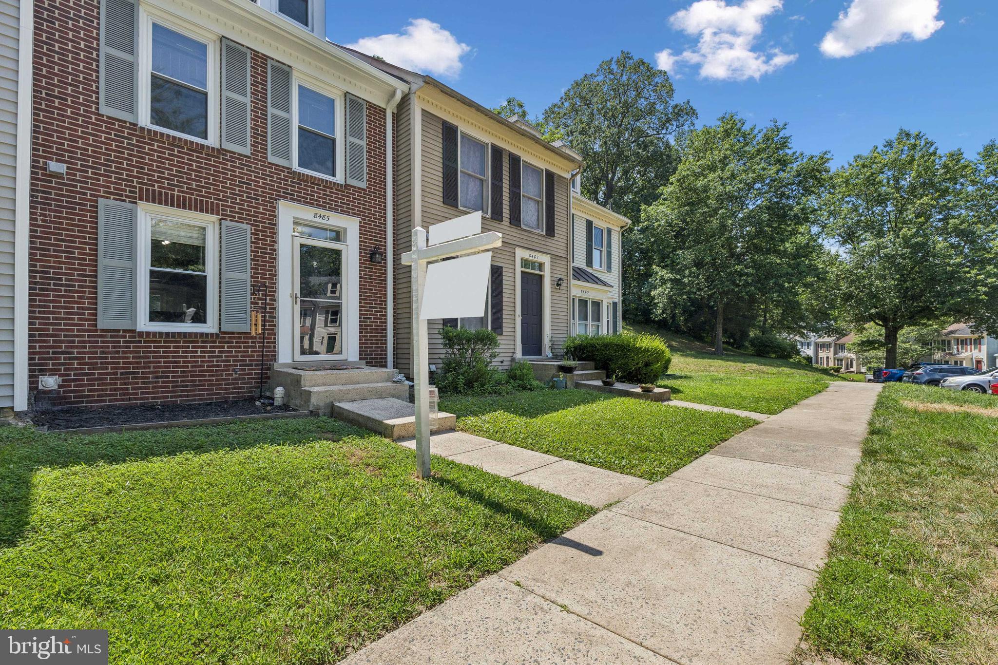 8485 Laurel Oak Drive Springfield, VA 22153 - Photo 3 of 40 a front view of a house with yard and green space