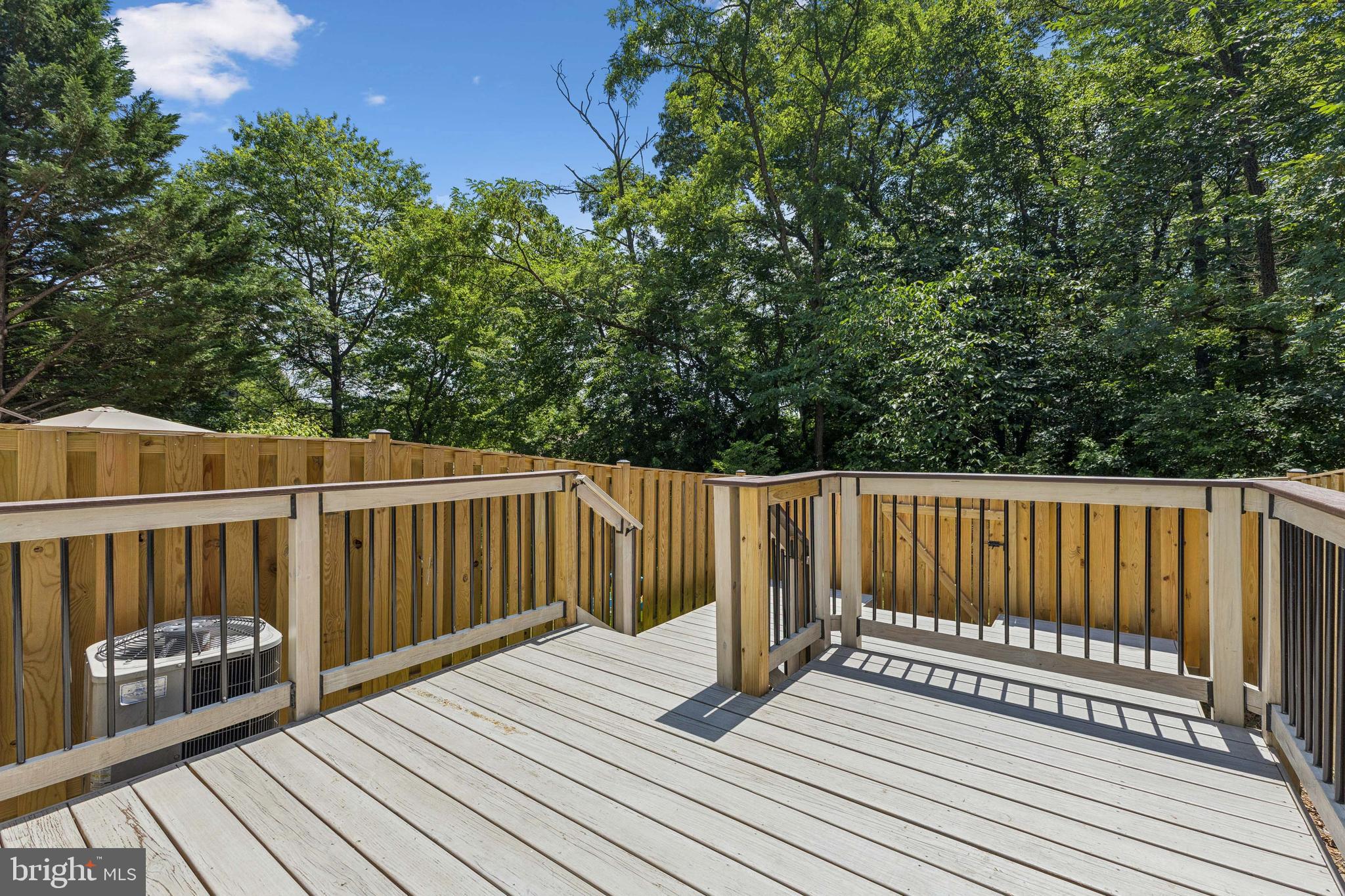 8485 Laurel Oak Drive Springfield, VA 22153 - Photo 36 of 40 a view of deck with wooden floor and outdoor seating