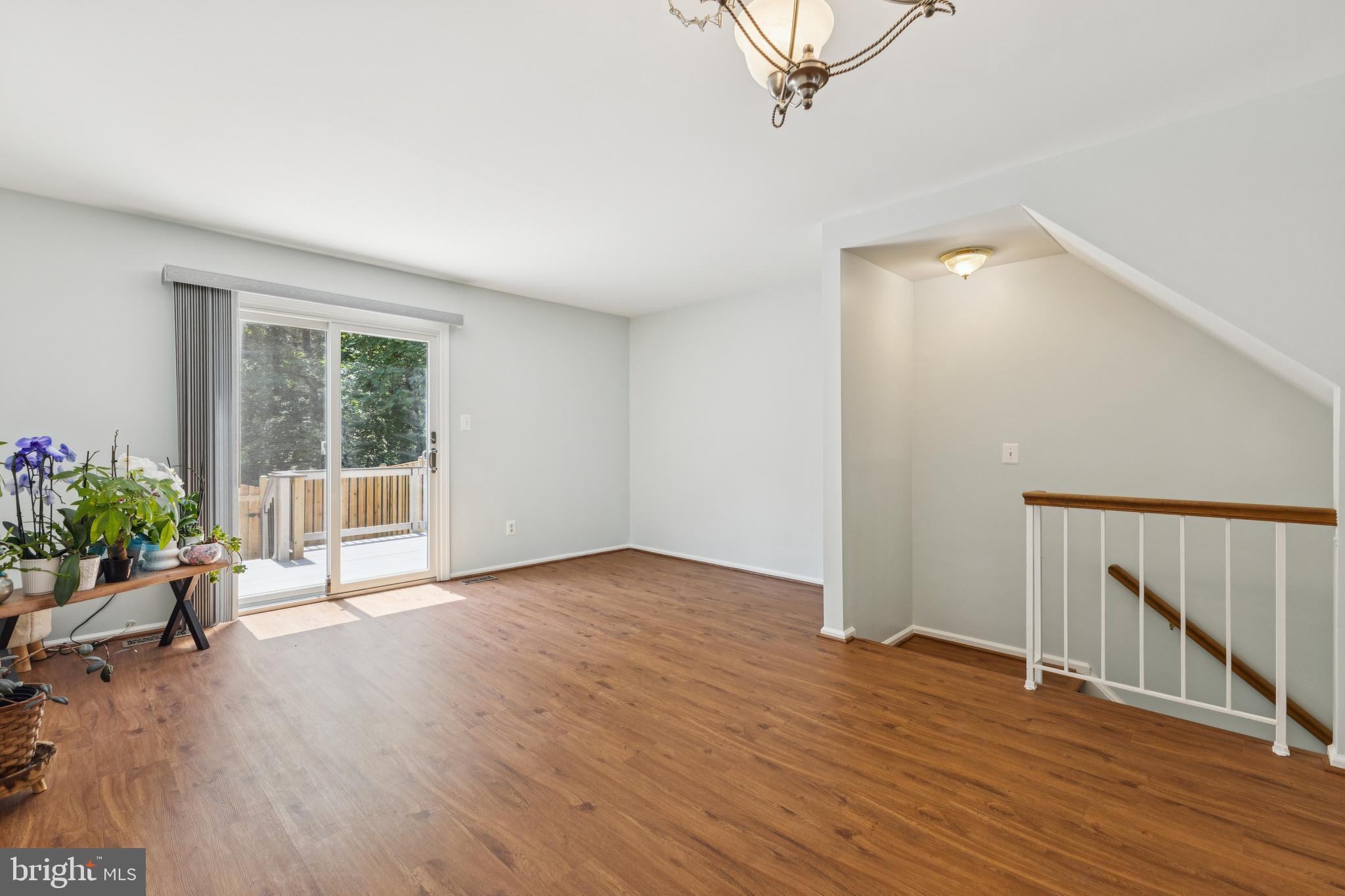 8485 Laurel Oak Drive Springfield, VA 22153 - Photo 10 of 40 a view of an empty room with wooden floor and a window
