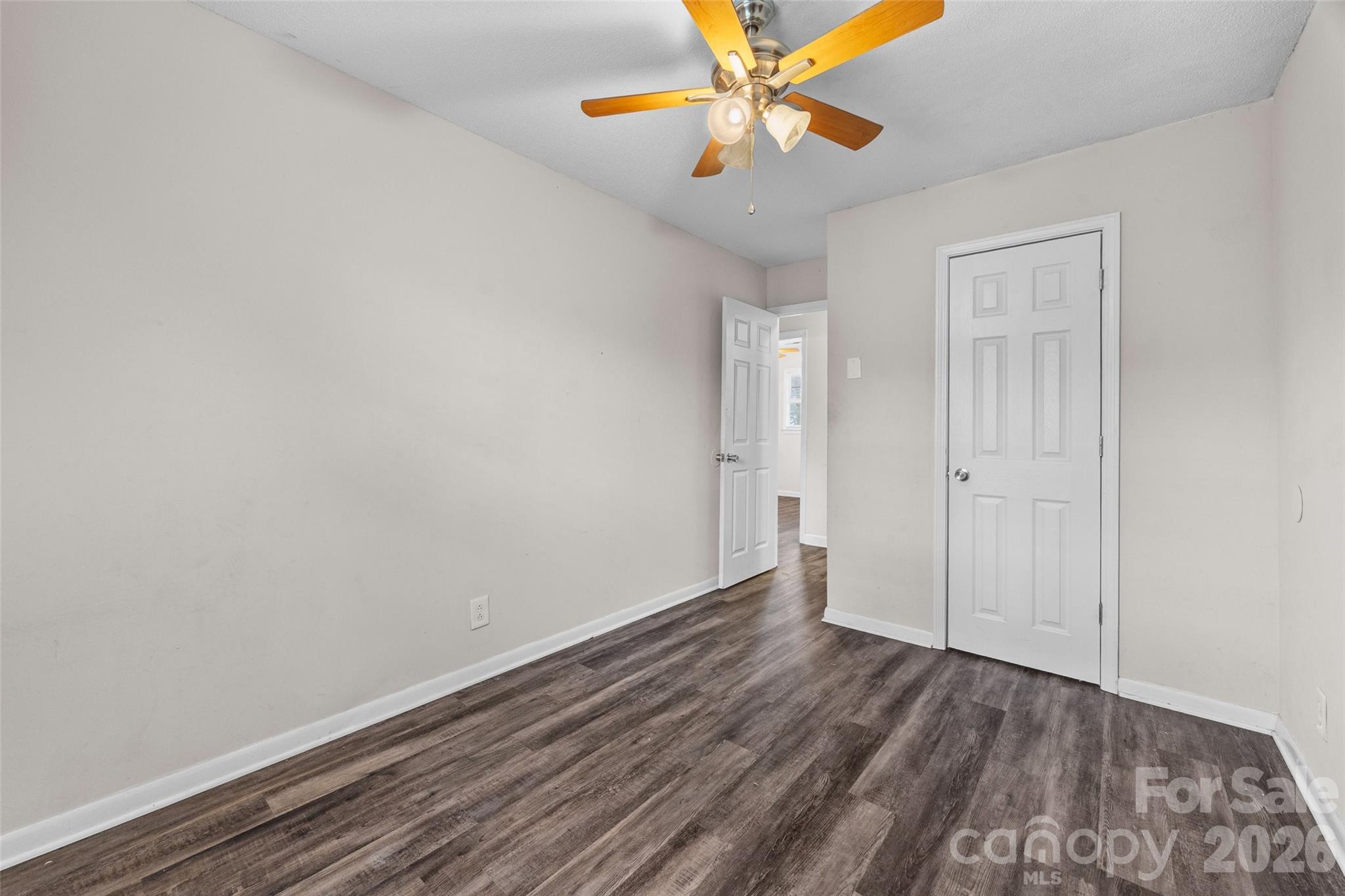 105 McGee Street Fort Mill, SC 29715 - Photo 14 of 23 a view of an empty room with wooden floor