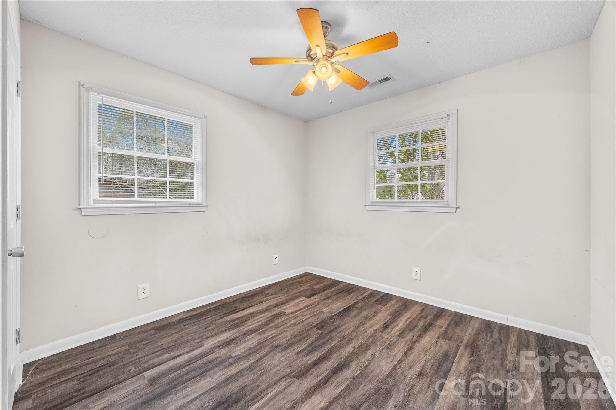 105 McGee Street Fort Mill, SC 29715 - Photo 15 of 23 an empty room with a window and a ceiling fan