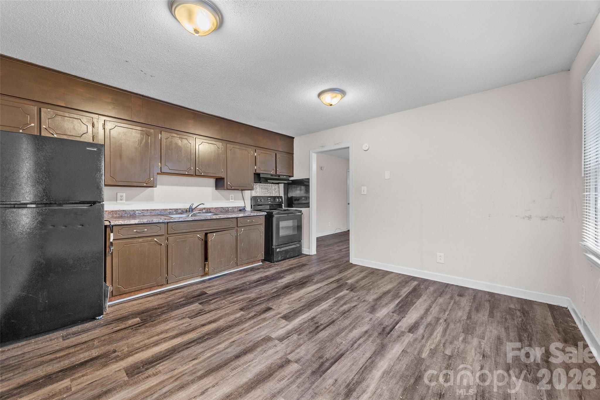 105 McGee Street Fort Mill, SC 29715 - Photo 8 of 23 a kitchen with a refrigerator and a stove top oven