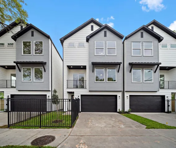 a front view of a house with garage