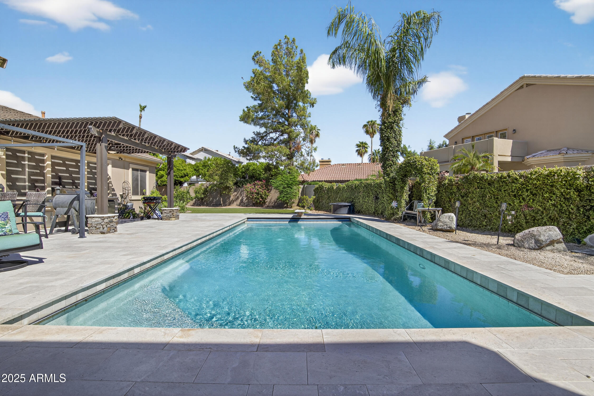1333 North Cliffside Drive Gilbert, AZ 85234 - Photo 66 of 98 a view of a swimming pool with a patio