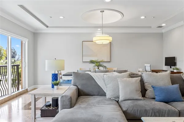 a view of a dining room with furniture wooden floor and chandelier