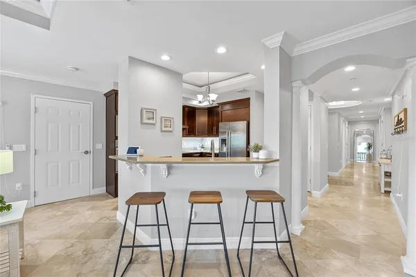 a kitchen with a refrigerator and a sink