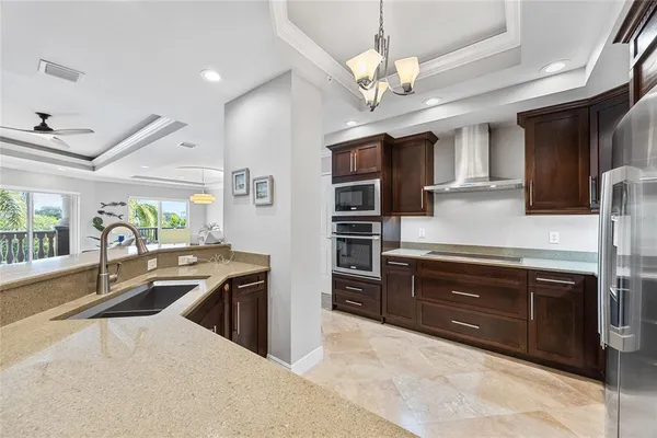 a kitchen with lots of counter top space and stainless steel appliances
