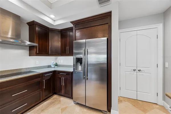 a kitchen with stainless steel appliances a refrigerator and a stove